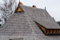 Traditional pine wood shingle roofing on a log house