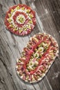 Traditional Plateful of Appetizer Savory Dishes Meze on Old Cracked Flaky Wooden Surface