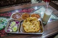 Traditional platter from Punjab (Punjabi Thali), with a glass of lassi, Amritsar, Ind