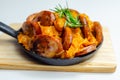 Traditional Polish dish called bigos made of sauerkraut, sausage and mushrooms, food served warm in a cast iron pan Royalty Free Stock Photo