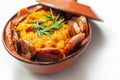 Traditional Polish dish called bigos made of sauerkraut, sausage and mushrooms, food served warm in a ceramic bowl Royalty Free Stock Photo