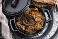 Traditional polish sauerkraut bigos with mushrooms and plums for christmas Royalty Free Stock Photo