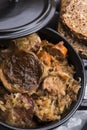 Traditional polish sauerkraut bigos with mushrooms and plums for christmas Royalty Free Stock Photo