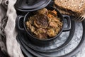 Traditional polish sauerkraut bigos with mushrooms and plums Royalty Free Stock Photo