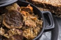 Traditional polish sauerkraut bigos with mushrooms and plums for christmas