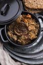 Traditional polish sauerkraut bigos with mushrooms and plums for christmas Royalty Free Stock Photo