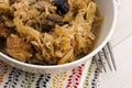 Traditional polish sauerkraut (bigos) with mushrooms and plums Royalty Free Stock Photo