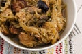Traditional polish sauerkraut (bigos) with mushrooms and plums Royalty Free Stock Photo