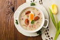 Traditional Polish white borsch with Easter decoration Royalty Free Stock Photo