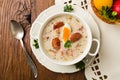 Traditional Polish white borsch with Easter decoration Royalty Free Stock Photo