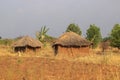 A traditional poor African village in Uganda made of earthenware round huts Royalty Free Stock Photo