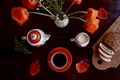 Traditional poppy seed bun with cup of tea and milk near poppies flowers and dishes with poppies ornaments. Delicious Royalty Free Stock Photo