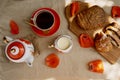 Traditional poppy seed bun with cup of tea and milk near poppies flowers and dishes with poppies ornaments. Delicious Royalty Free Stock Photo