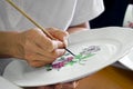 Traditional porcelain painter hand work, Herend Porcelain Manufacture, Hungary