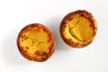 Traditional Portuguese custard pastry called a pasteis de nata isolated on white background