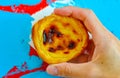 Traditional Portuguese custard tart, pastel de nata, with colorful background