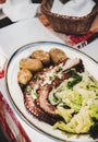 Traditional portuguese dish with grilled octopus, boiled potato and cabbage Royalty Free Stock Photo