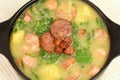 Traditional portuguese green soup called caldo verde seen from above close Royalty Free Stock Photo