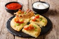 Traditional potato pancakes Boxty with bacon, tomatoes, onions a Royalty Free Stock Photo