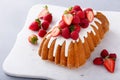 Traditional pound cake topped with glaze and fresh berries Royalty Free Stock Photo