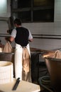 Process of making wheels of parmigiano-reggiano parmesan cheese on small cheese farm in Parma, Italy