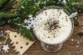 Traditional prune dessert with nuts and whipped sour cream with sugar. New Year`s sweet treat concept. Wooden boards background Royalty Free Stock Photo