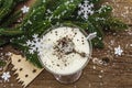 Traditional prune dessert with nuts and whipped sour cream with sugar. New Year`s sweet treat concept. Wooden boards background Royalty Free Stock Photo