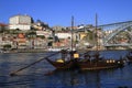 Traditional rabelo boats, Porto city skyline, Douro river and and Dom Luis or Luiz iron bridge. Porto