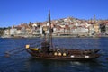 Traditional rabelo boats, Porto city skyline, Douro river and and Dom Luis or Luiz iron bridge. Porto