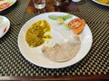 Traditional Rajasthani meal - chapati,besan gatte vegetable and roti served at Indian restaurant