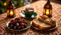 Ramadan Iftar Table with Dates Bread and Hot Tea at Night Royalty Free Stock Photo
