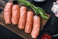 Traditional raw pork sausages, flat lay, on black background Royalty Free Stock Photo