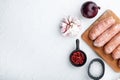 Traditional raw pork sausages, flat lay with space for text, on white background