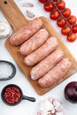 Traditional raw pork sausages, flat lay, on white background