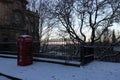 Traditional red British telephone box covered with snow Royalty Free Stock Photo