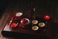 Traditional red chinese tea set, red porcelain with traditioanl chinese theatre masks