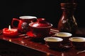 Traditional red chinese tea set, red porcelain with traditioanl chinese theatre masks Royalty Free Stock Photo