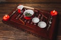 Traditional red chinese tea set, red porcelain with traditioanl chinese theatre masks