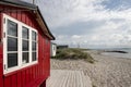 Traditional red colored beach hut in Eriks Hale, Marstal, ÃrÃ¸, Denmark.