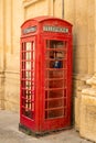 Traditional red english phone booth in Malta