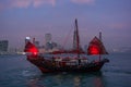 Traditional red junk boat in the Victoria Harbor in Hong Kong Royalty Free Stock Photo