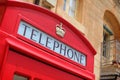 Traditional red phone booth in Malta Royalty Free Stock Photo