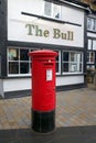 Traditional Red Post Box outside a Public House in England