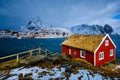 Traditional red rorbu house in Reine village on Lofoten Islands,