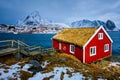 Traditional red rorbu house in Reine village on Lofoten Islands,