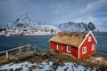 Traditional red rorbu house in Reine village on Lofoten Islands,