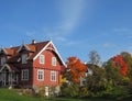 Traditional red scandinavian house in autumn