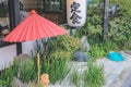?traditional red umbrella in garden for green tea ceremony