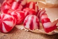 Traditional red and white candies on wooden backgrou