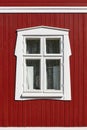 Traditional red wooden house facade in Rauma town. Finland heritage.